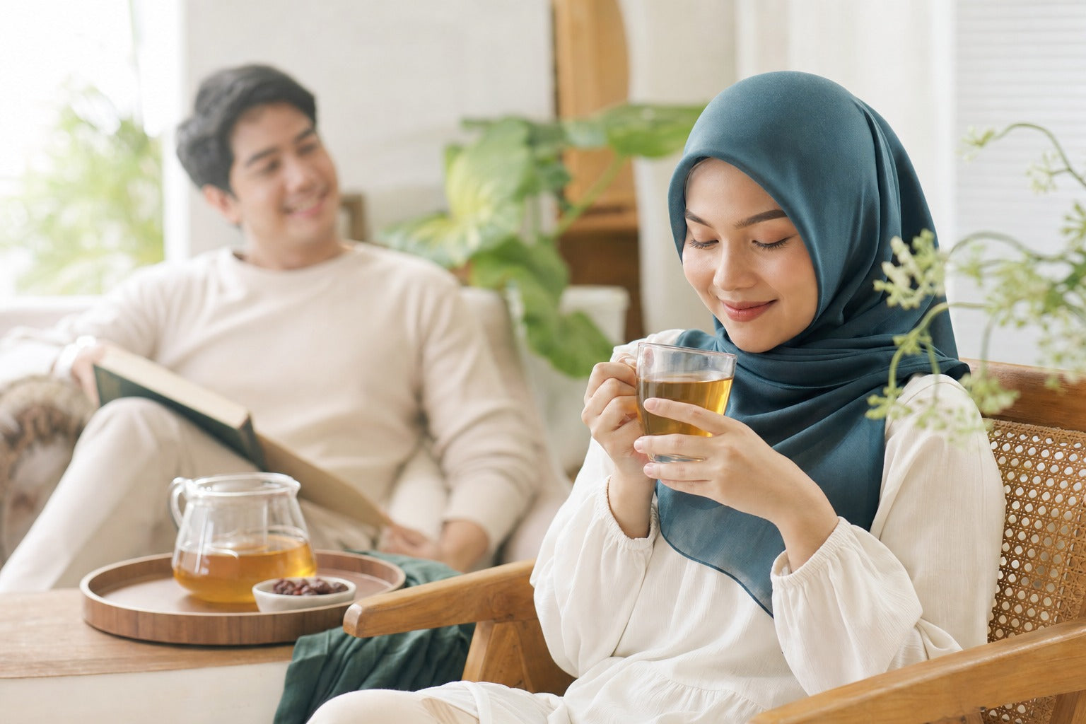 A calm reassuring wellness still life — a glass of golden drink in soft neutral light, safety and trust